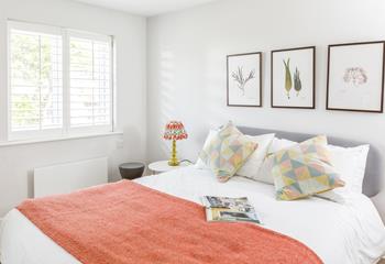 This airy and uncluttered bedroom provides a calming space to unwind after a day of adventures! 