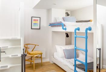 Children will love the bunk beds in Bedroom 3! Space-saving stairs lead up to a snug room with TV, providing kids with their own space.