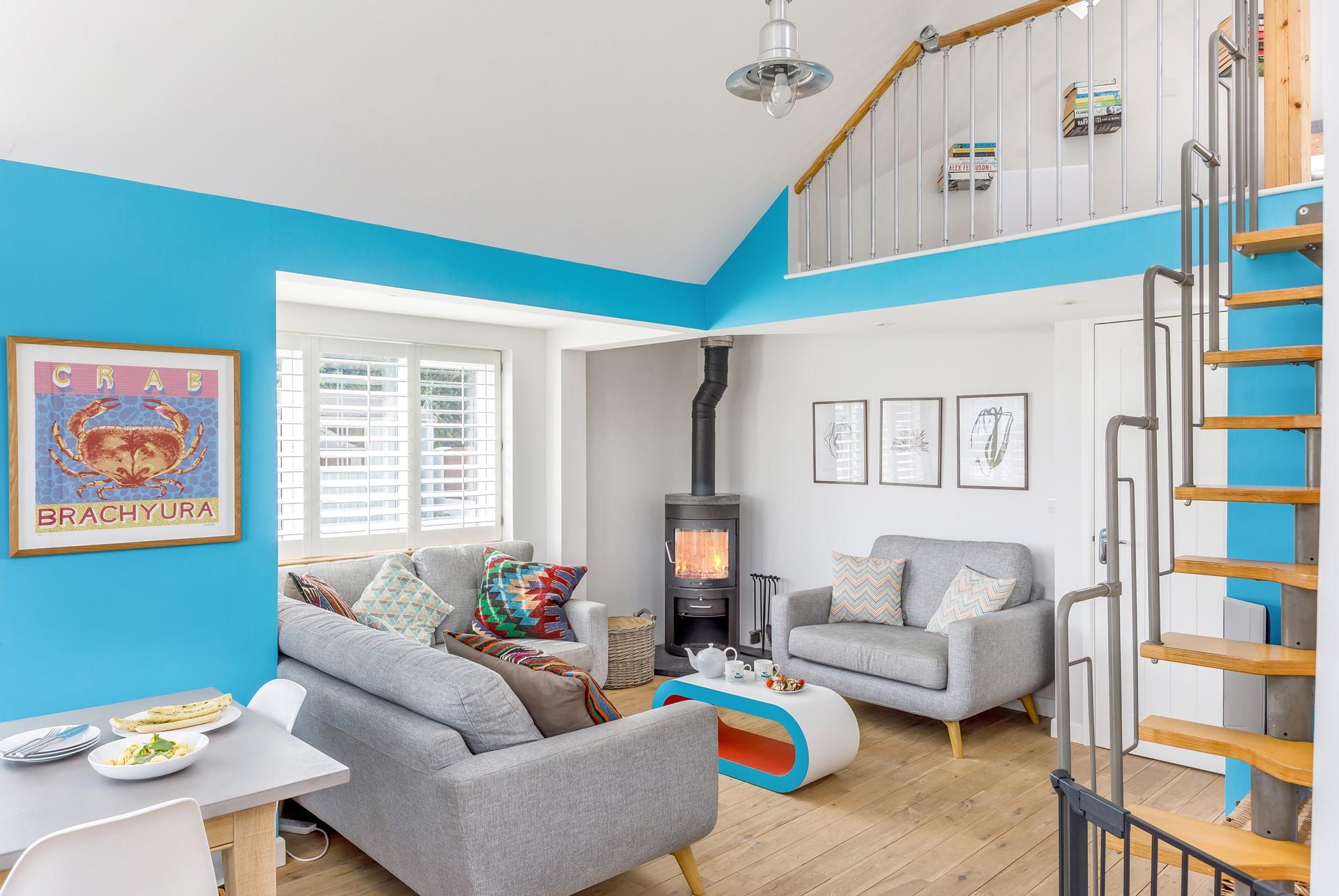 The stylish lounge with its cosy woodburner is perfect for gathering the family together for an evening of films and board games!