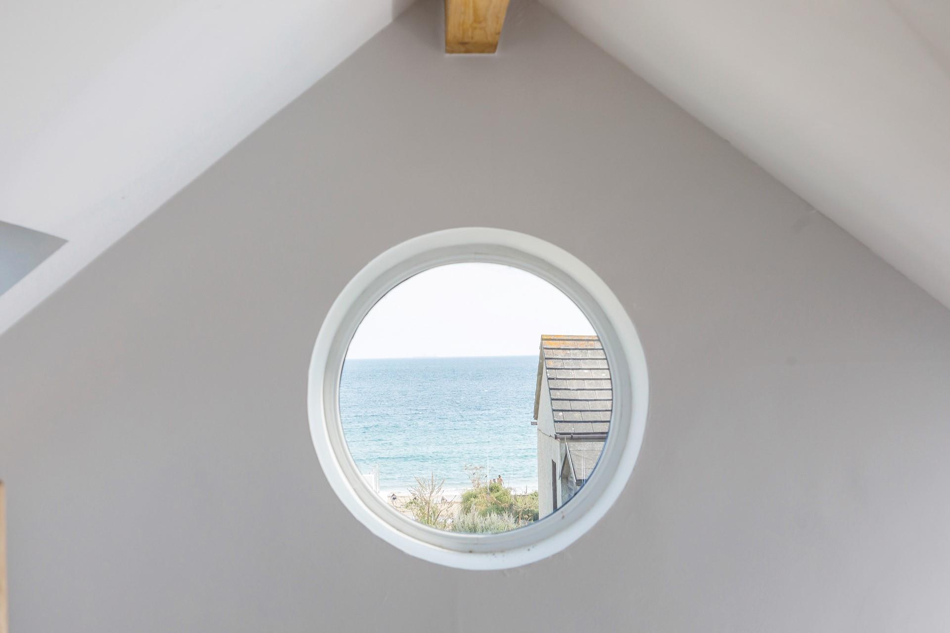 The unusual Porthole window with a view of Praa Sands Beach is sure to delight children with the illusion of really being on a boat!