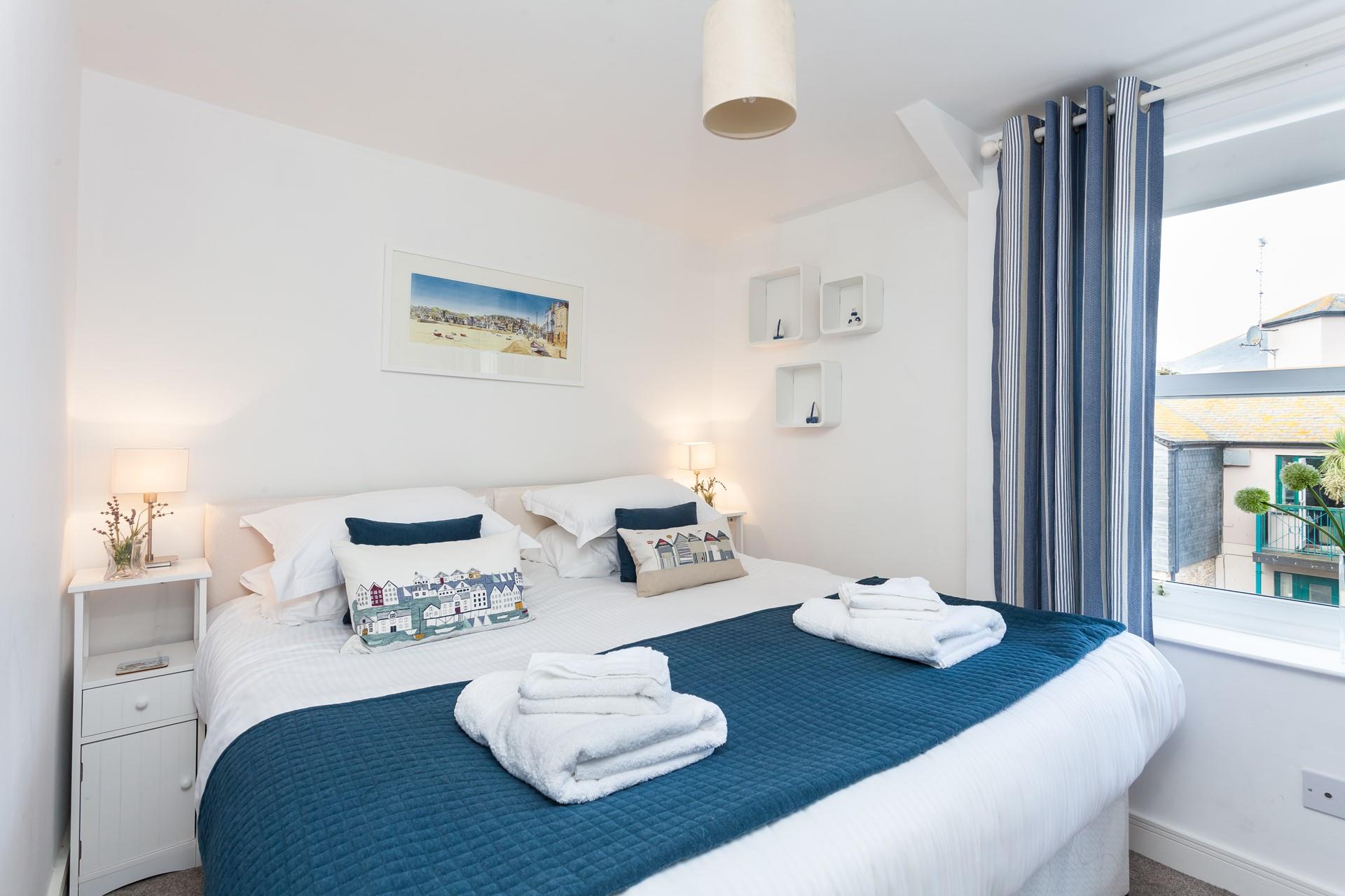 Bedroom 1 has zip and link beds, offering guests flexible sleeping arrangements.