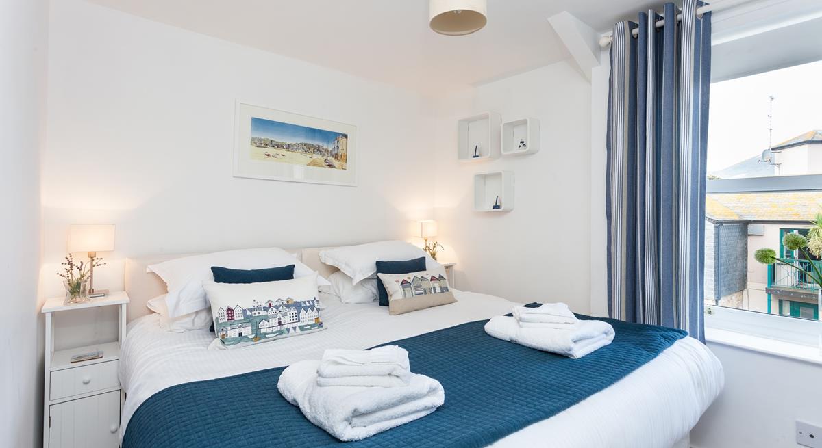 Bedroom 1 has zip and link beds, offering guests flexible sleeping arrangements.