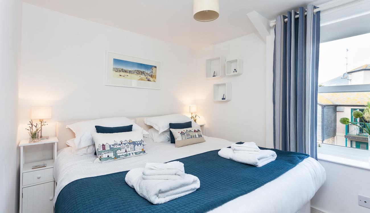 Bedroom 1 has zip and link beds, offering guests flexible sleeping arrangements.