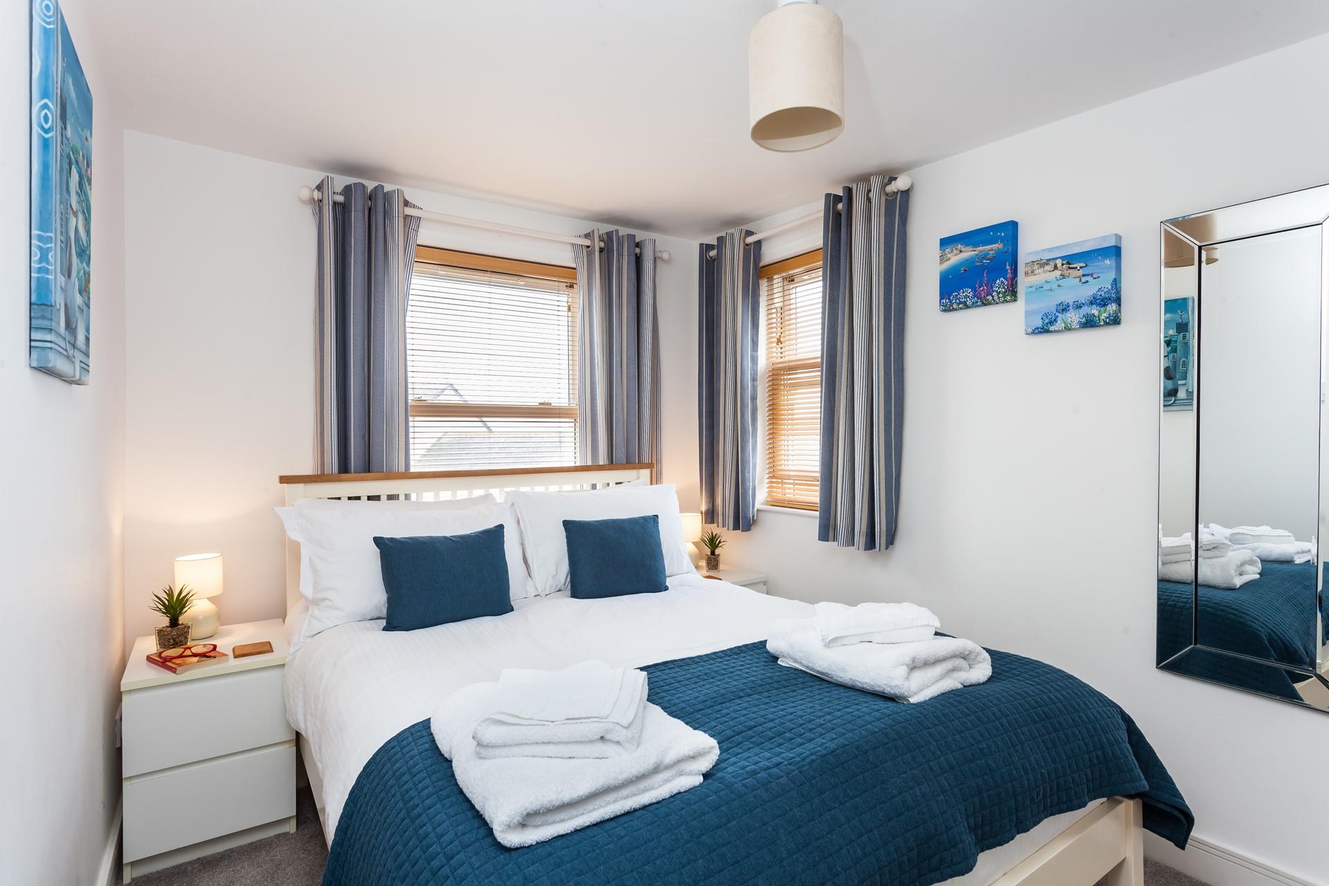 Seaside blue tones create a calming space to relax each evening.