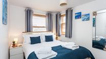 Seaside blue tones create a calming space to relax each evening.
