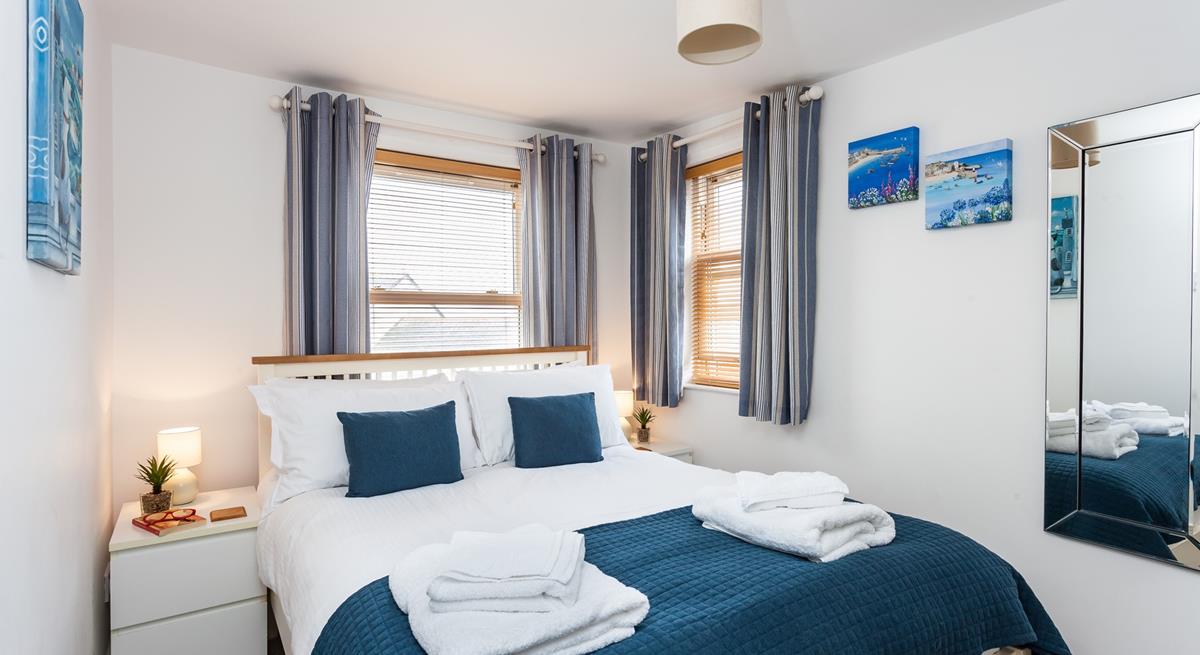 Seaside blue tones create a calming space to relax each evening.