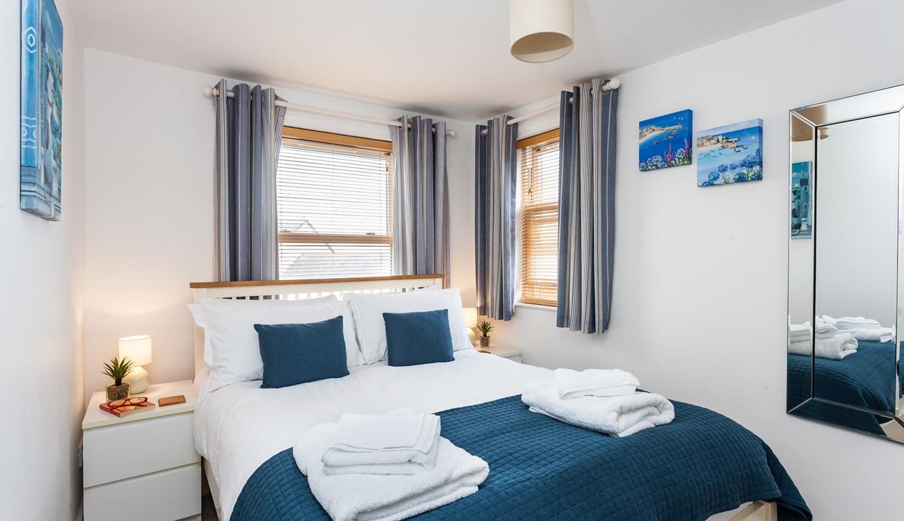 Seaside blue tones create a calming space to relax each evening.