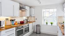 Beautifully presented, the kitchen is very well-equipped with modern appliances that make cooking up a feast a breeze.