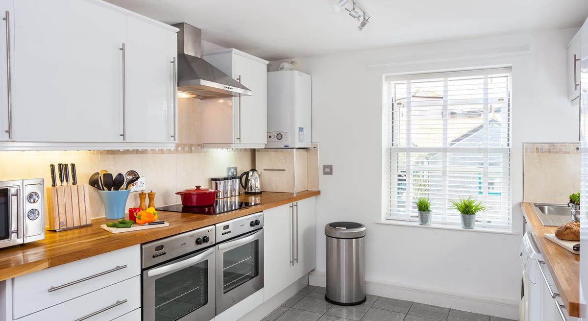 Beautifully presented, the kitchen is very well-equipped with modern appliances that make cooking up a feast a breeze.