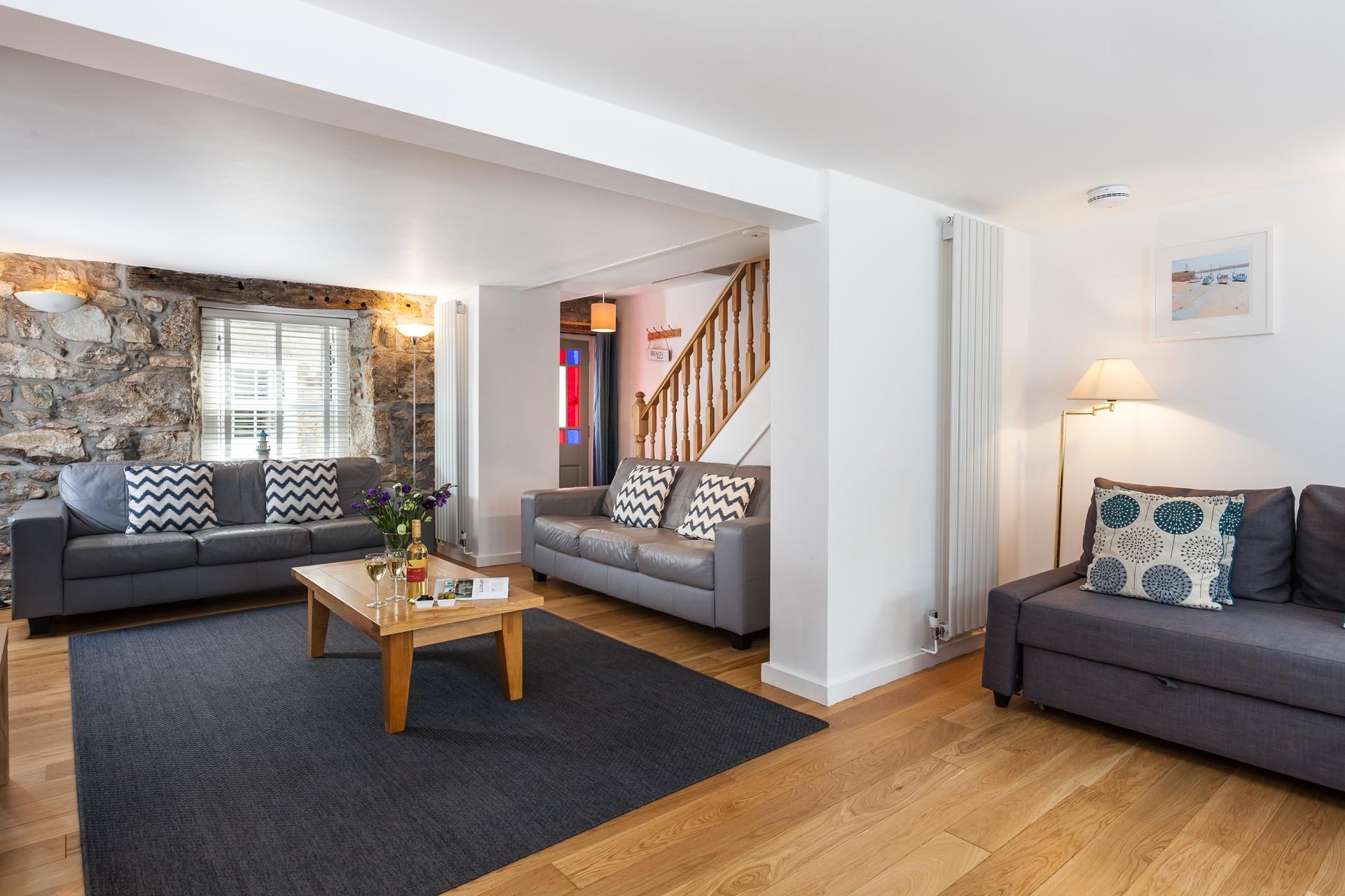 The original stone wall provides character and charm to this gorgeous property.