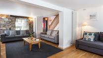 The original stone wall provides character and charm to this gorgeous property.