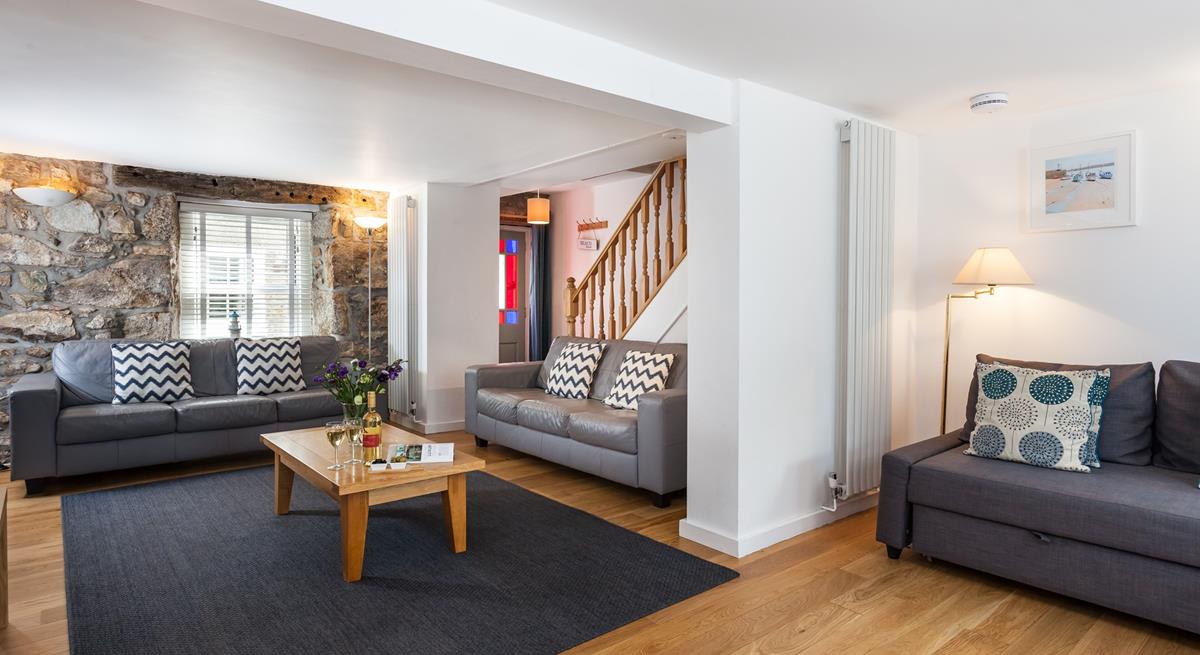 The original stone wall provides character and charm to this gorgeous property.