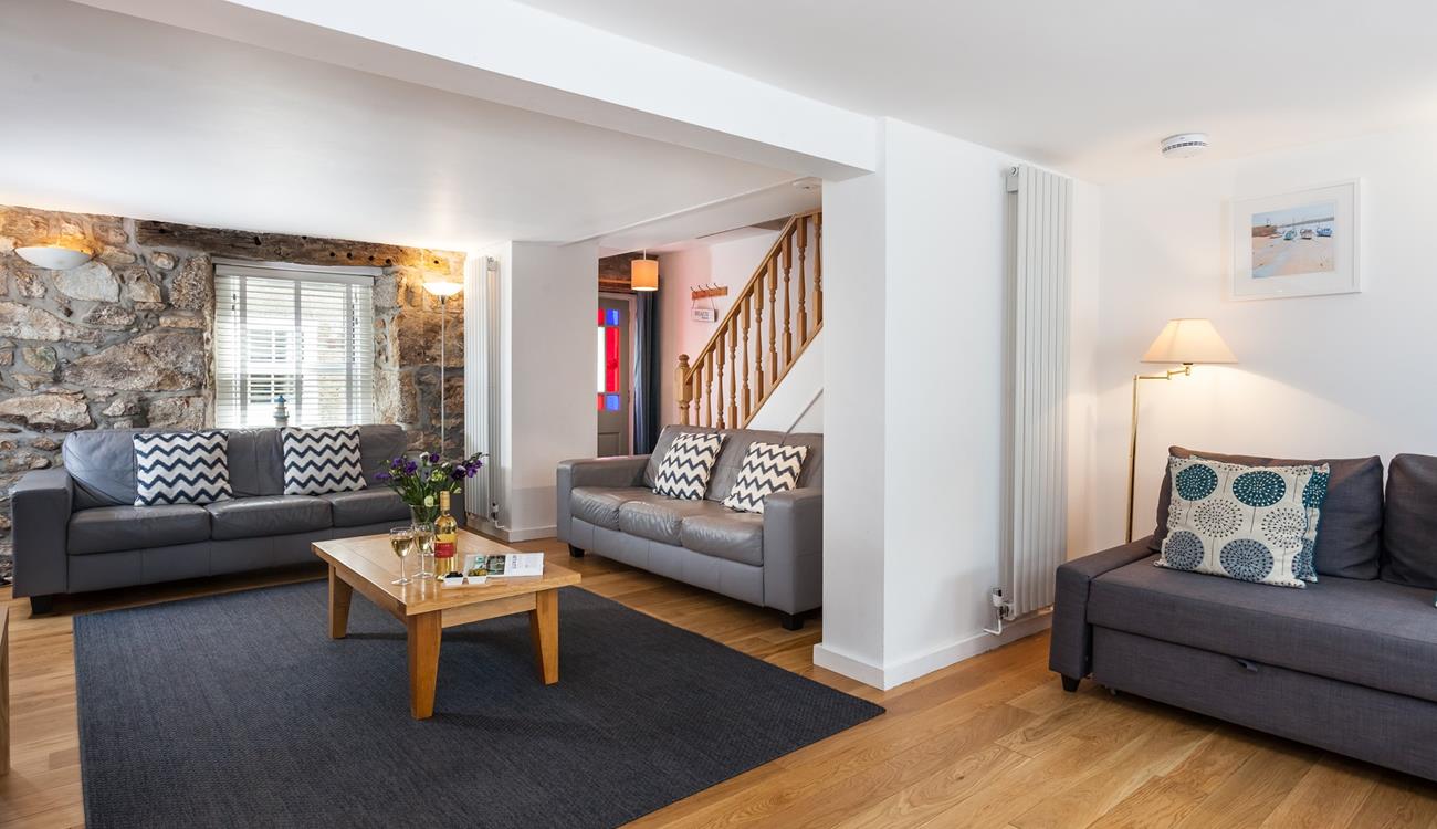 The original stone wall provides character and charm to this gorgeous property.