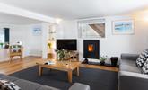 The sitting room is a modern and contemporary space, that is the perfect summer retreat or cosy winter haven. - Thumbnail Image