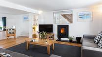 The sitting room is a modern and contemporary space, that is the perfect summer retreat or cosy winter haven.