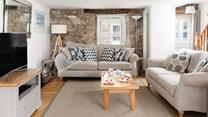 The original stone wall provides character and charm to this gorgeous property.