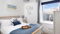 Bedroom 1 is the perfect spot to enjoy a lazy breakfast in bed. 