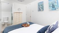 Bedroom 2 benefits from an en suite bathroom.