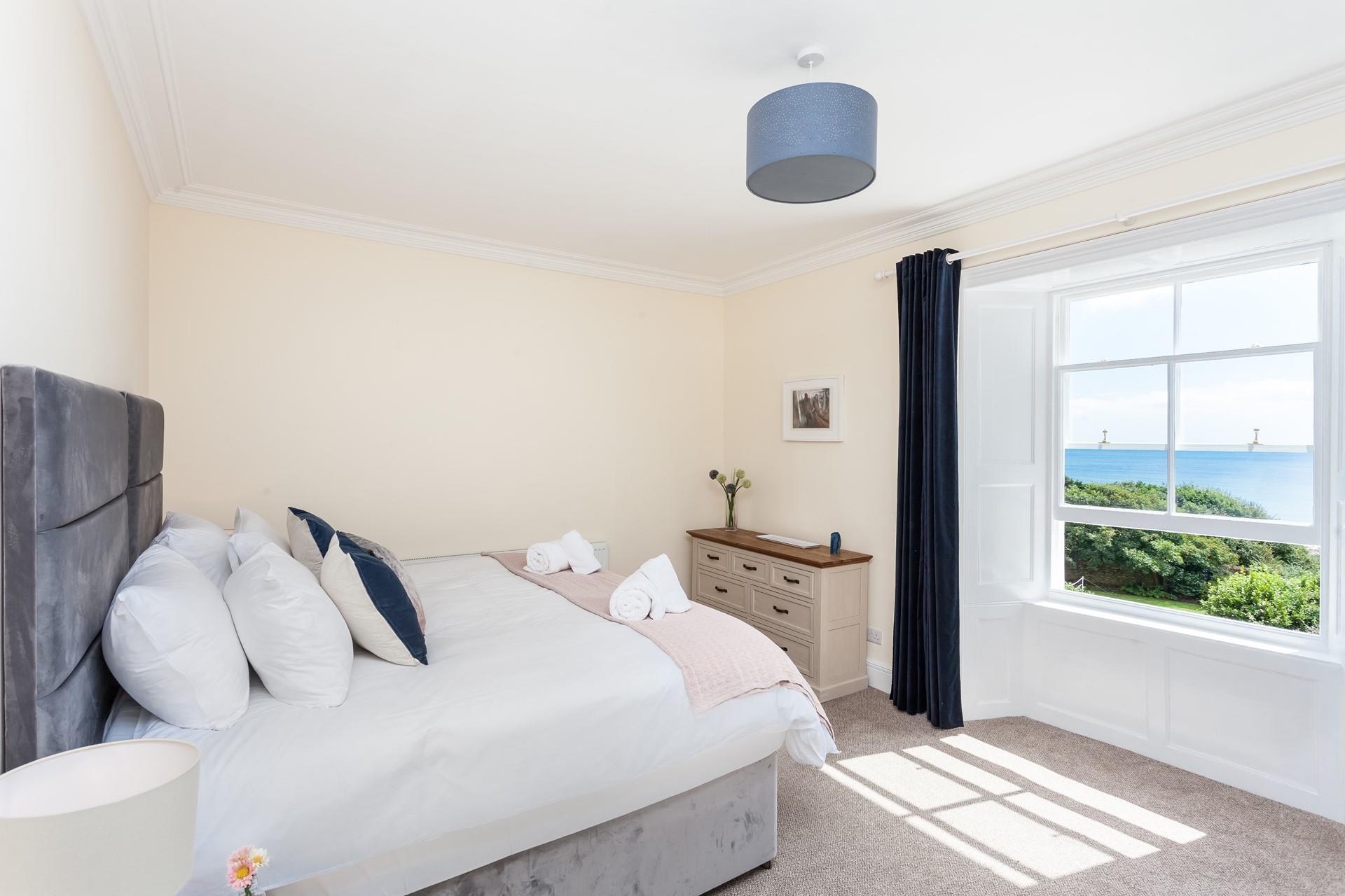 Zip and link beds in bedroom 4 are shown here made up as a luxurious super king size bed.