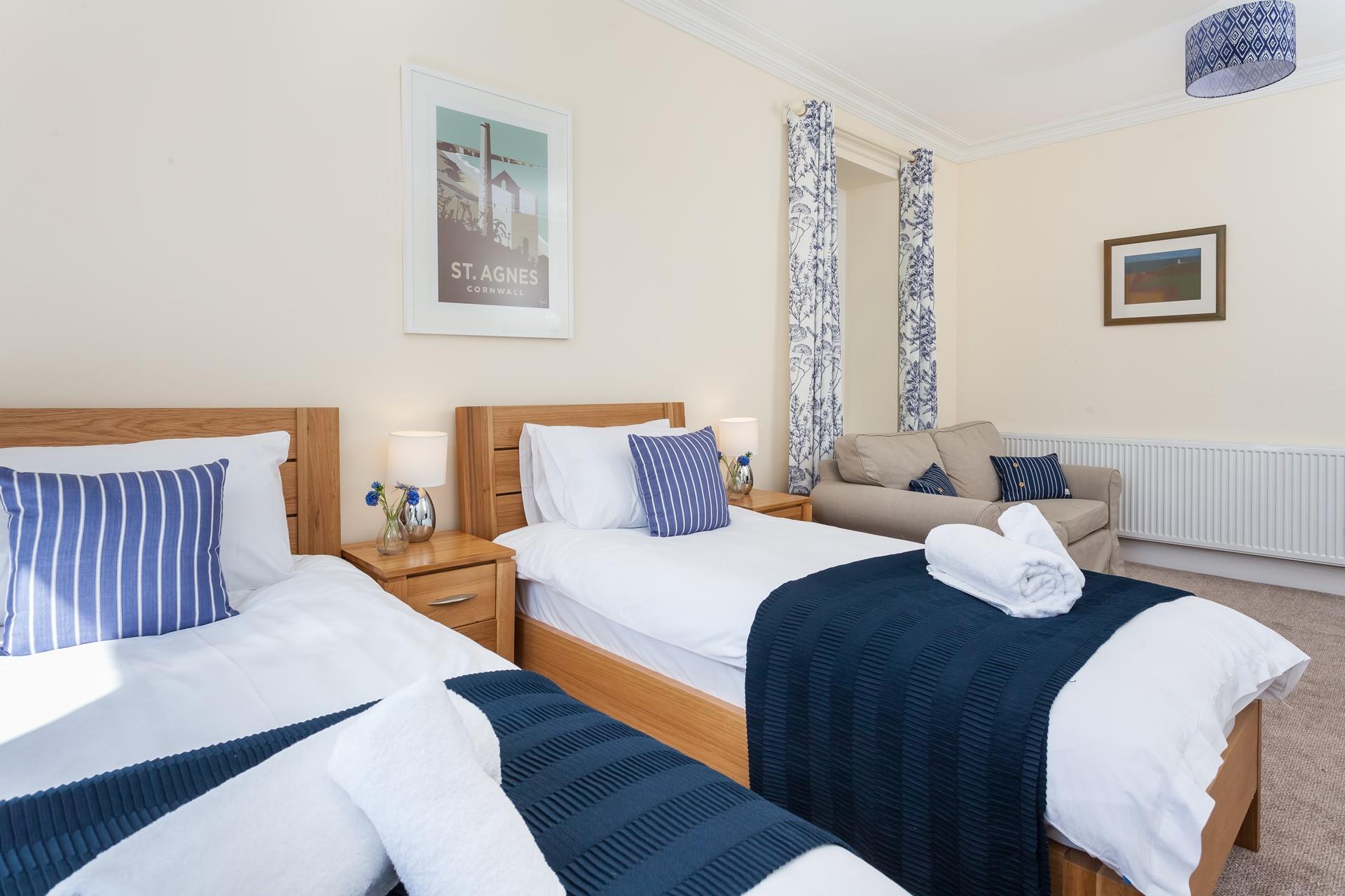 The spacious twin room has a sofa and large TV; perfect for the kids.