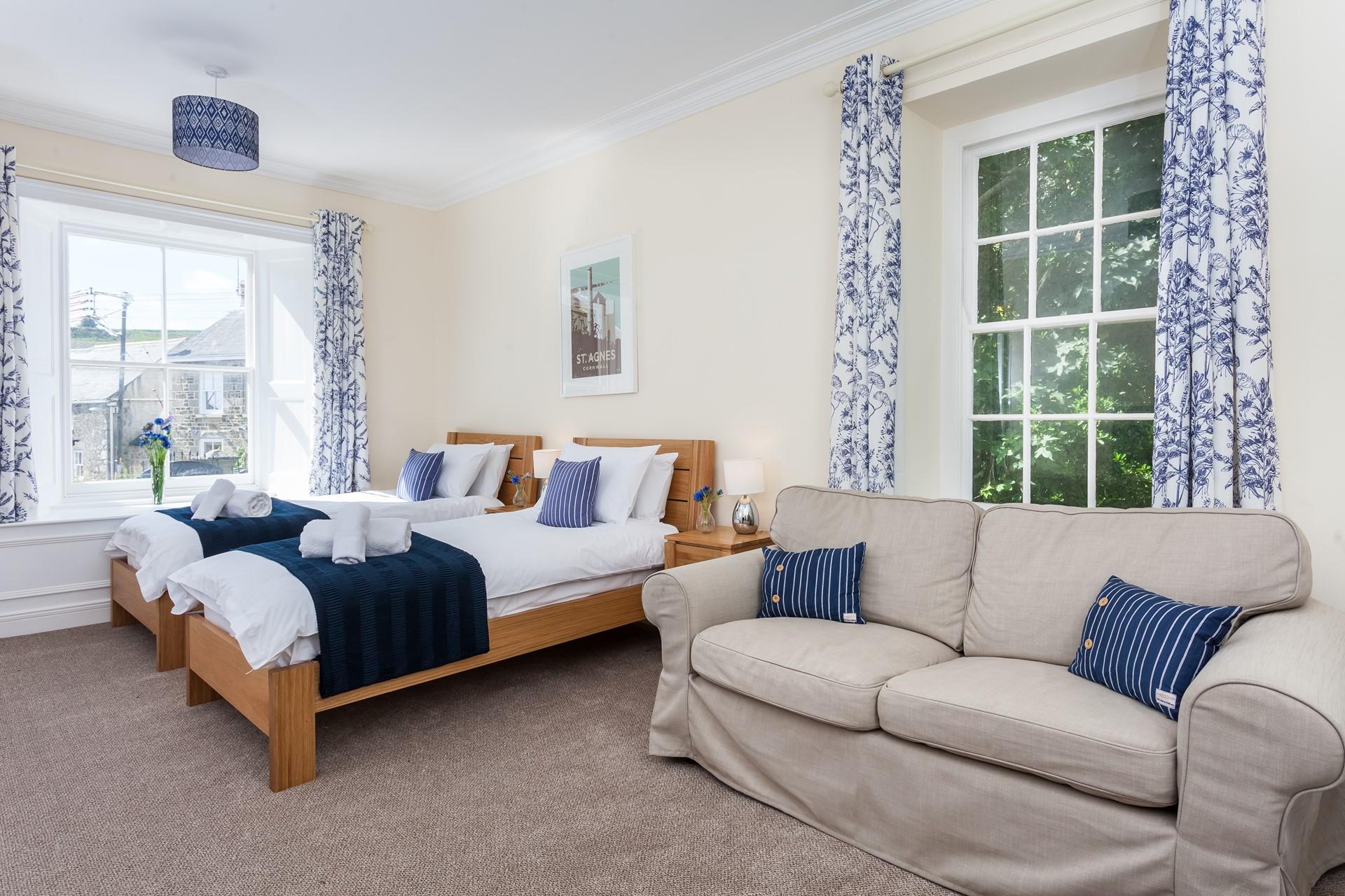 The twin room is at the back of the house with the far window looking out over the drive to the house. 