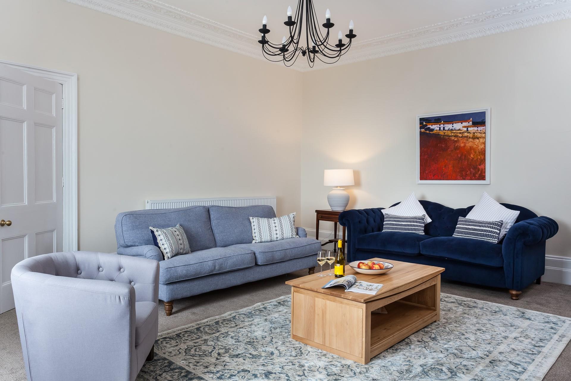 Large sofas and armchair seating in the sitting room. 