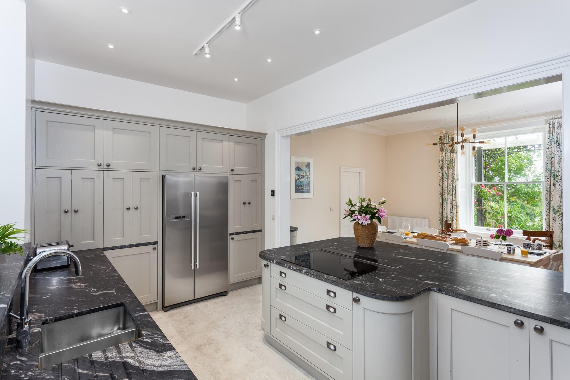 A spacious contemporary kitchen to facilitate cooking for your whole party. 