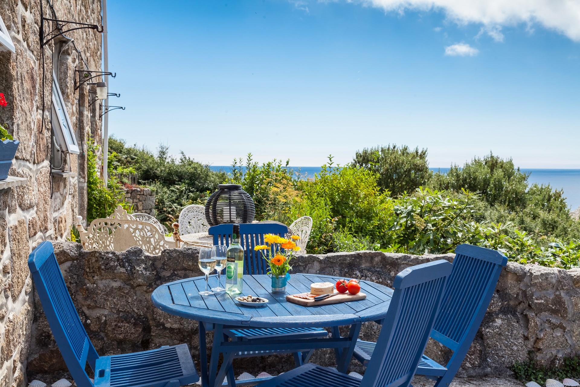 Dine al fresco at the front of the cottage and enjoy the spectacular sea views.