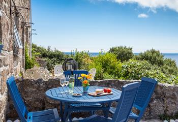 Dine al fresco at the front of the cottage and enjoy the spectacular sea views.