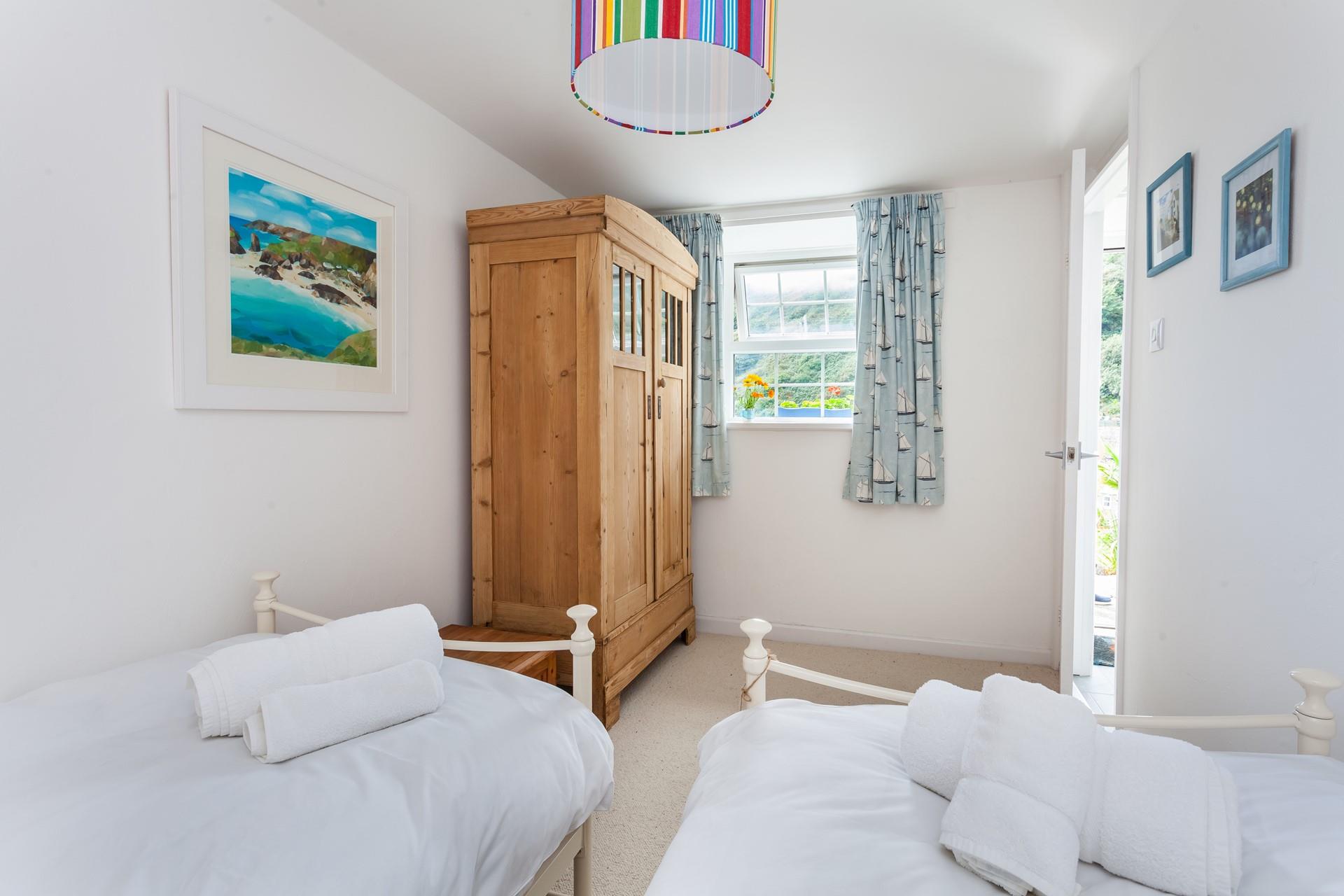 The spacious twin room has incredible sea views from the window. 