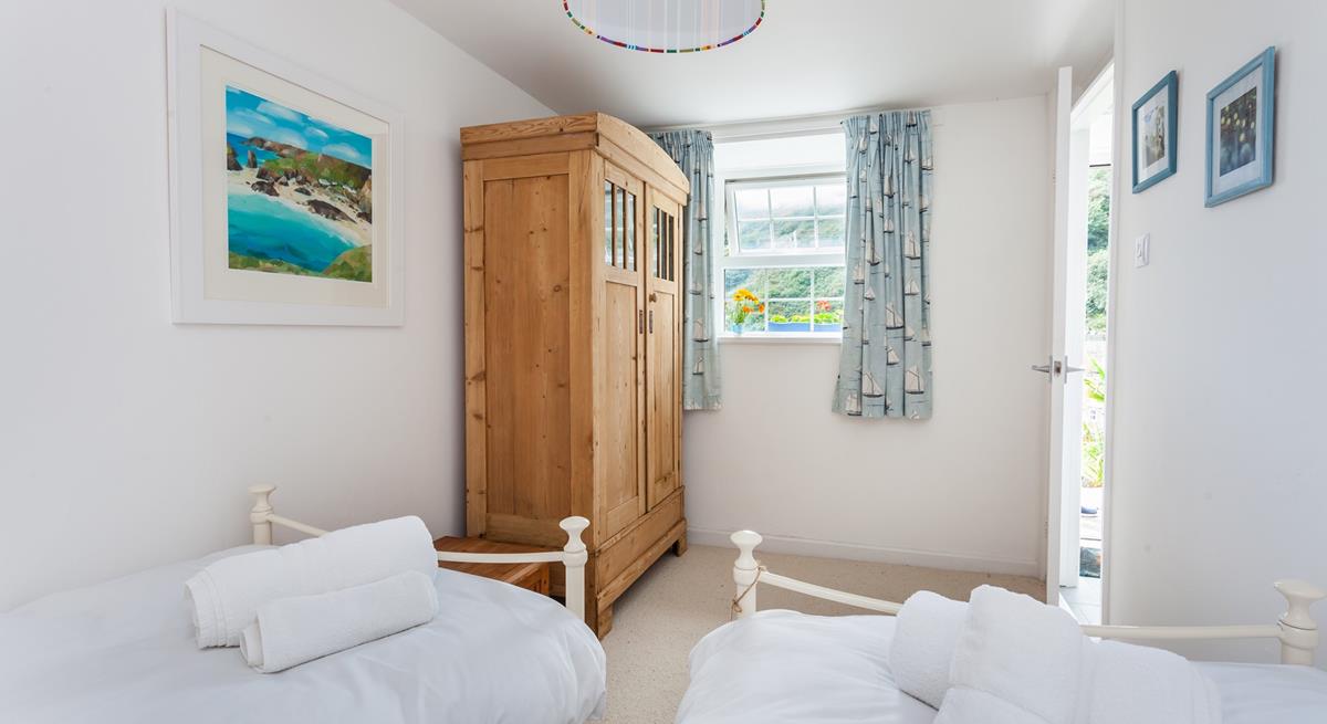 The spacious twin room has incredible sea views from the window. 