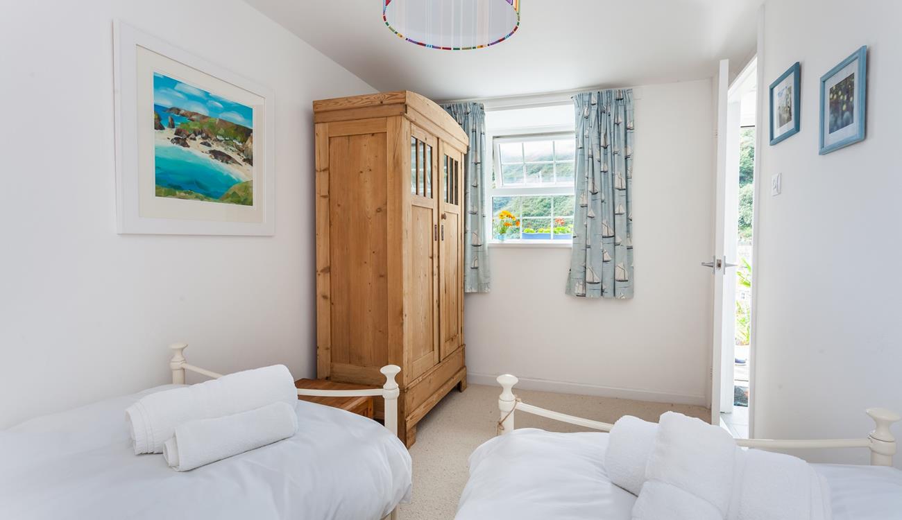 The spacious twin room has incredible sea views from the window. 