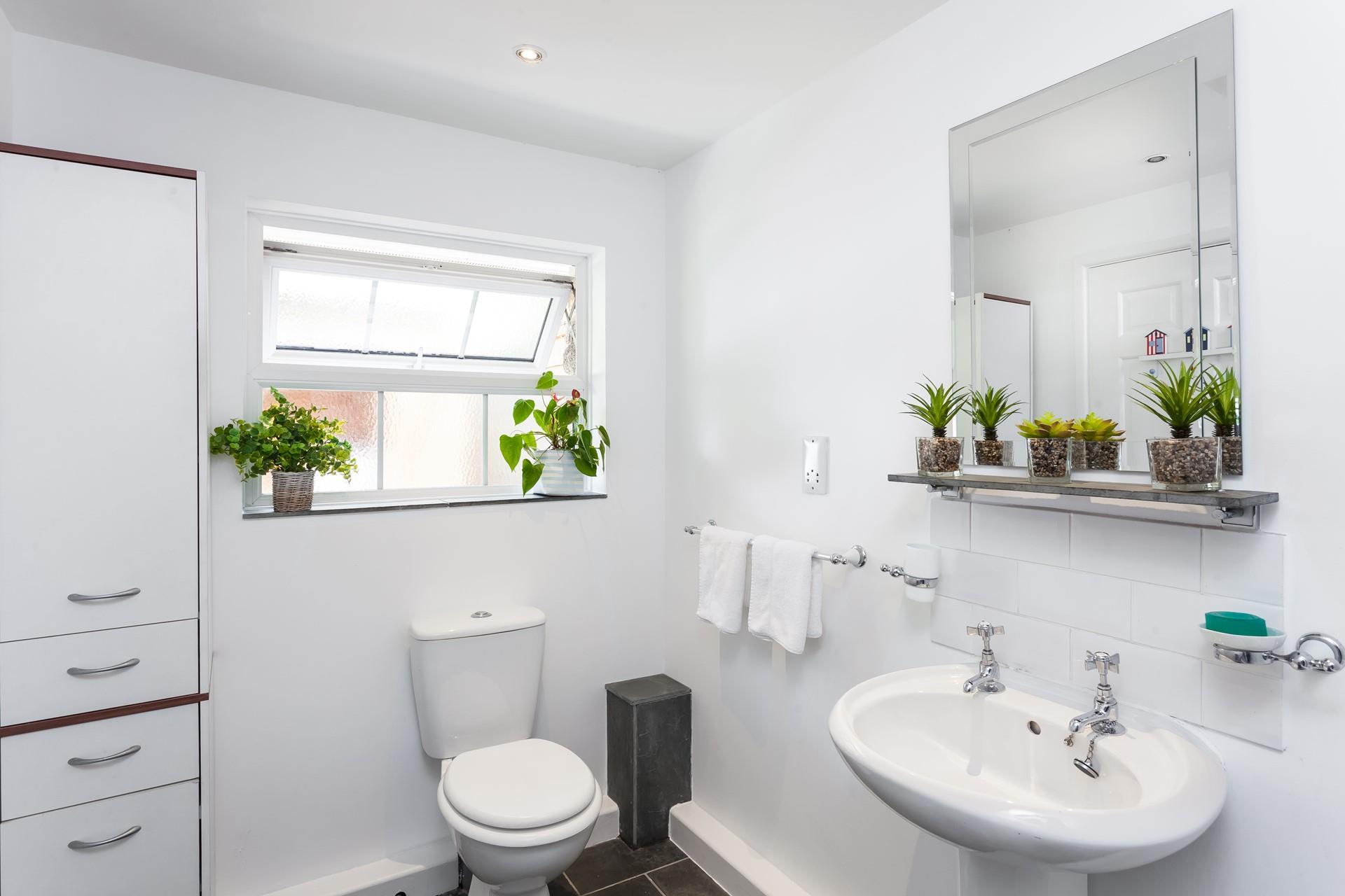 Freshen up in the bright and spacious bathroom after a lazy day at the beach or walking the coastal path.