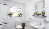 Freshen up in the bright and spacious bathroom after a lazy day at the beach or walking the coastal path. - Thumbnail Image