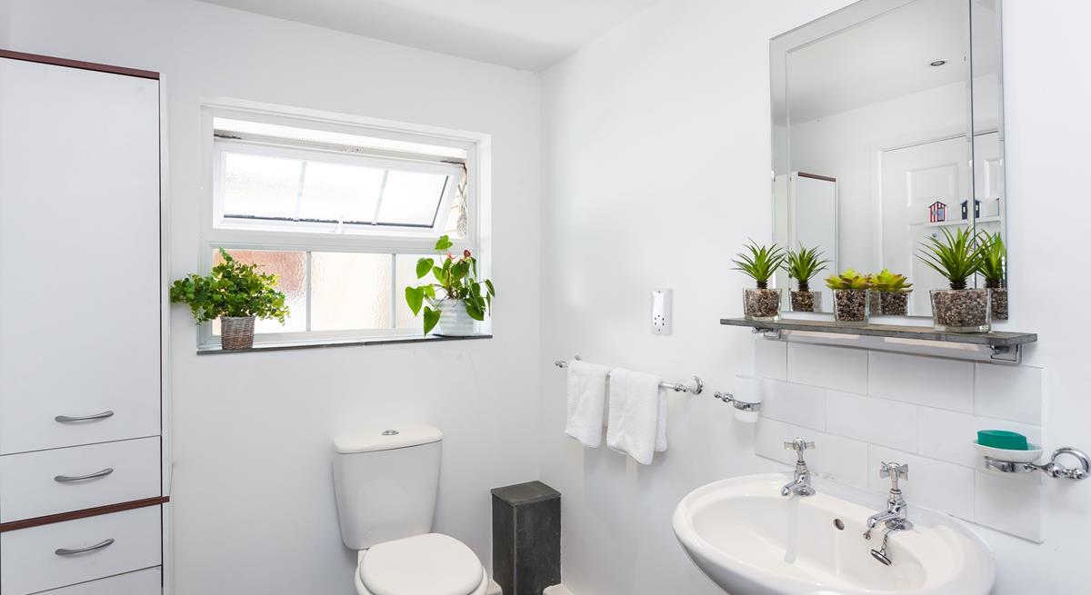 Freshen up in the bright and spacious bathroom after a lazy day at the beach or walking the coastal path.