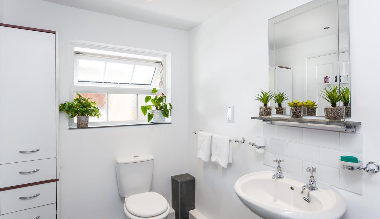 Freshen up in the bright and spacious bathroom after a lazy day at the beach or walking the coastal path.
