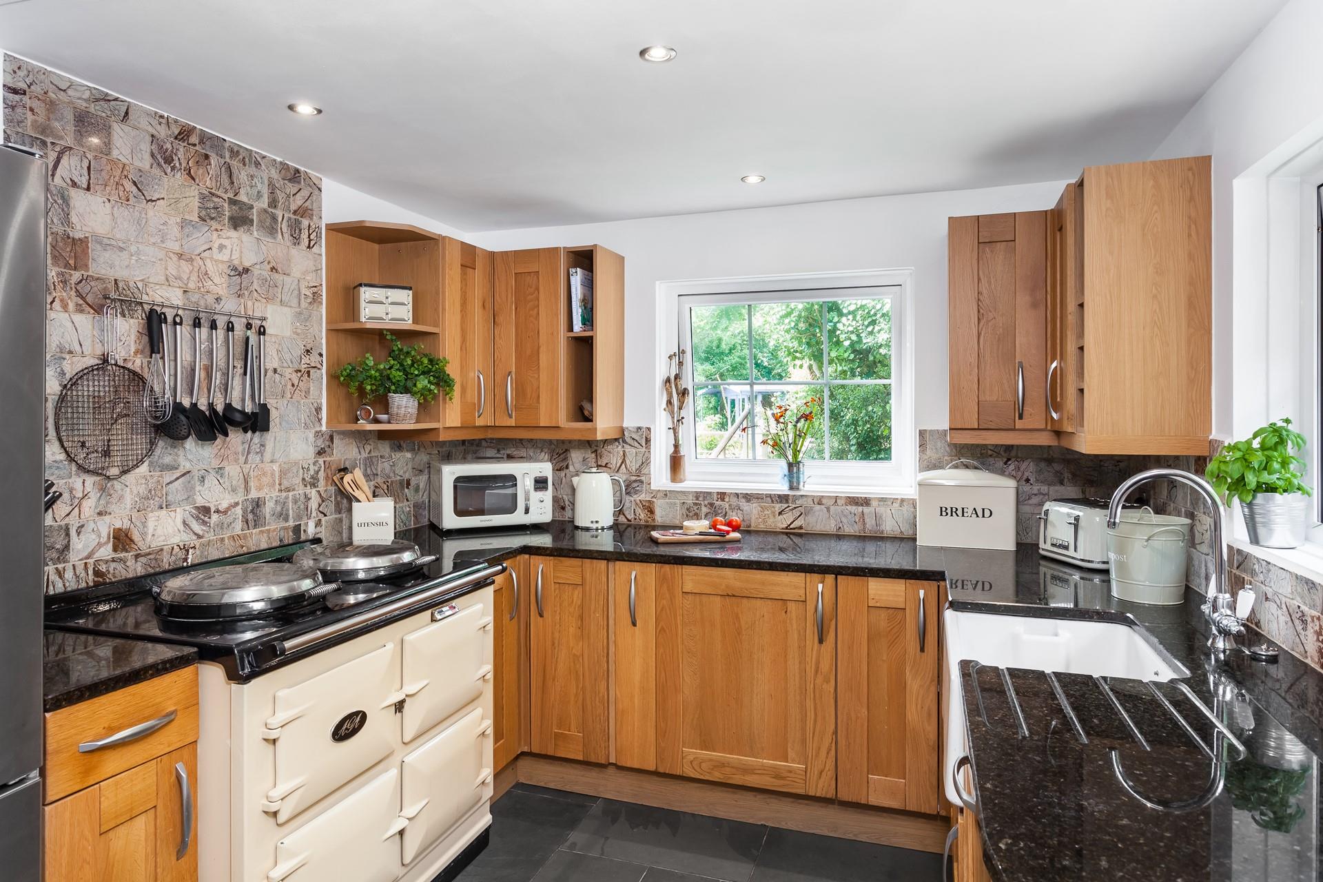 The electric Aga in the spacious kitchen is perfect for cooking a roast lunch or a family feast. 
