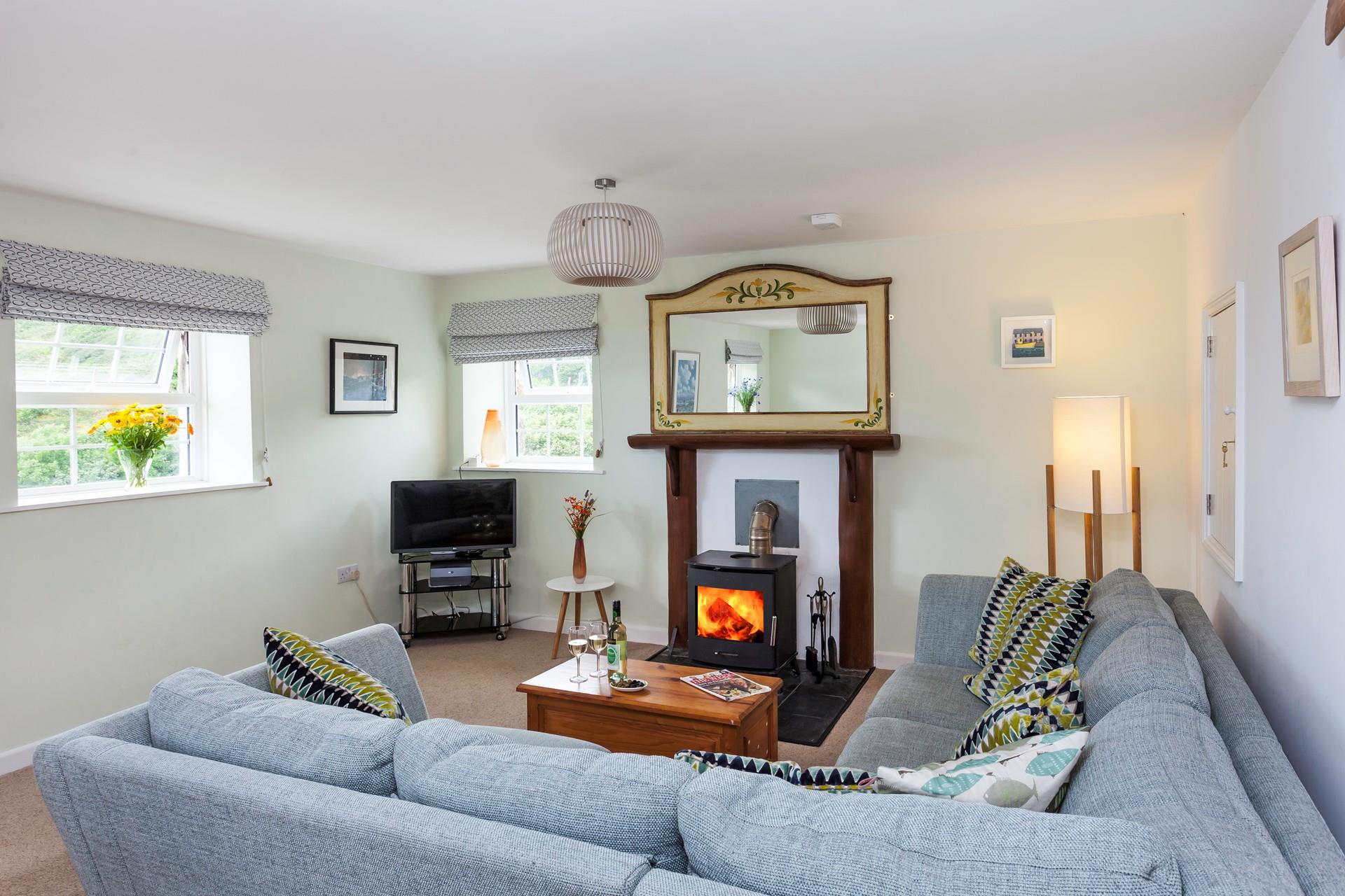 The comfortable furnishings and cosy woodburner provide the perfect environment in which to relax.