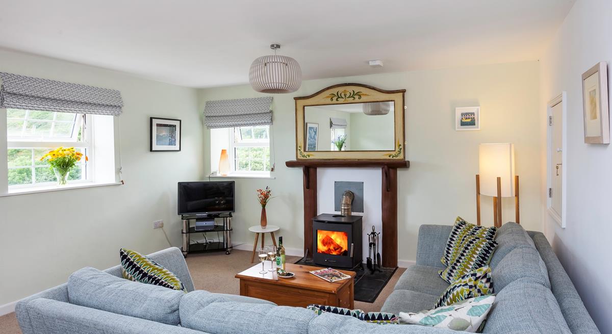 The comfortable furnishings and cosy woodburner provide the perfect environment in which to relax.