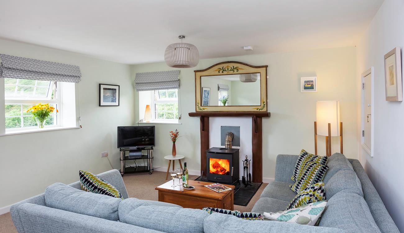 The comfortable furnishings and cosy woodburner provide the perfect environment in which to relax.
