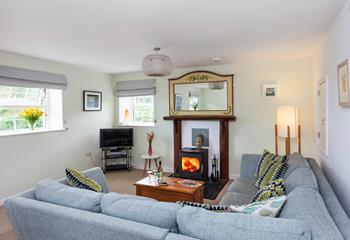 The comfortable furnishings and cosy woodburner provide the perfect environment in which to relax.