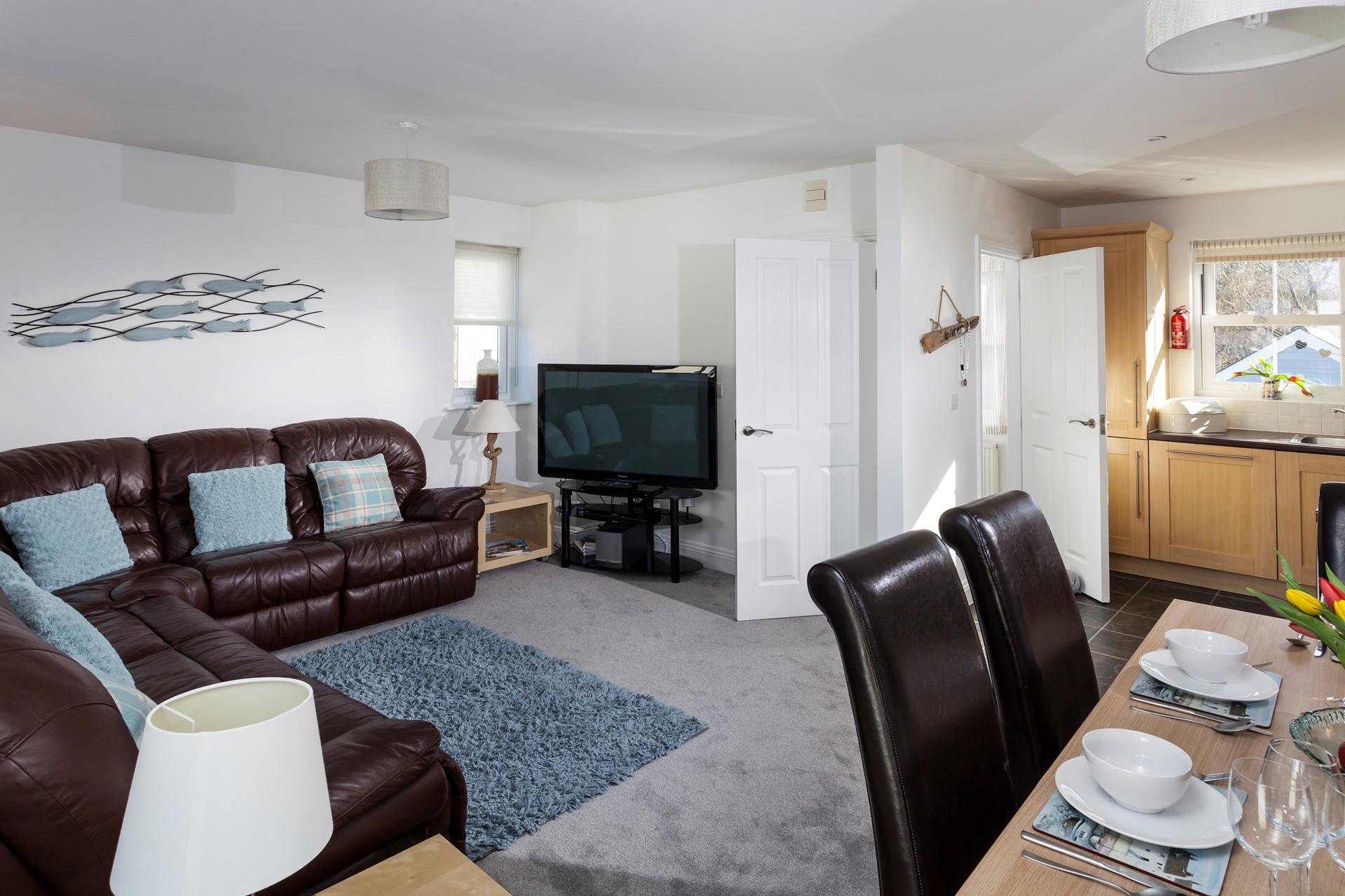 The open plan living area is a lovely space for the whole family to dine and relax in the evening.