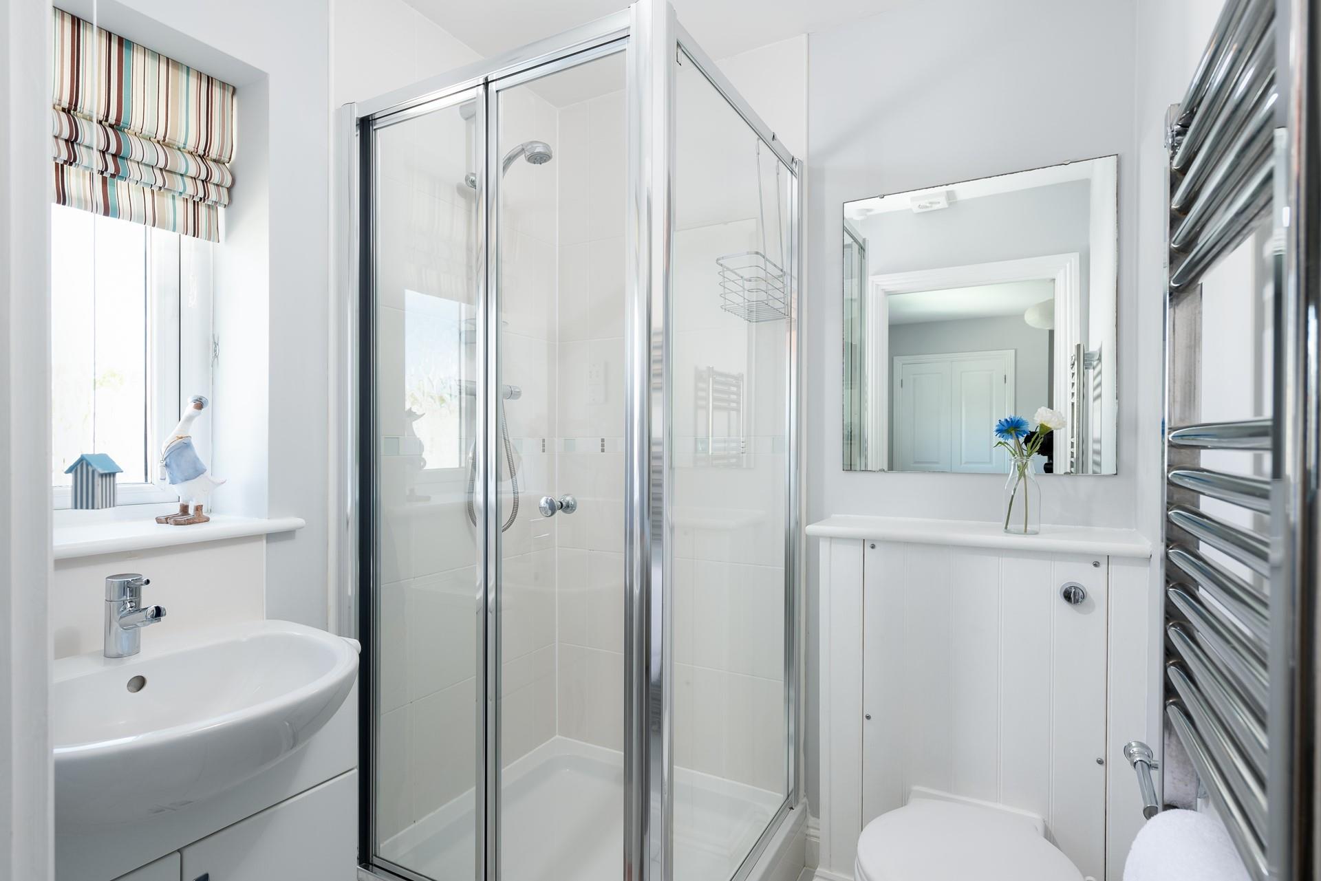 The en suite has a shower to wash off your sandy toes after a day on the beach.
