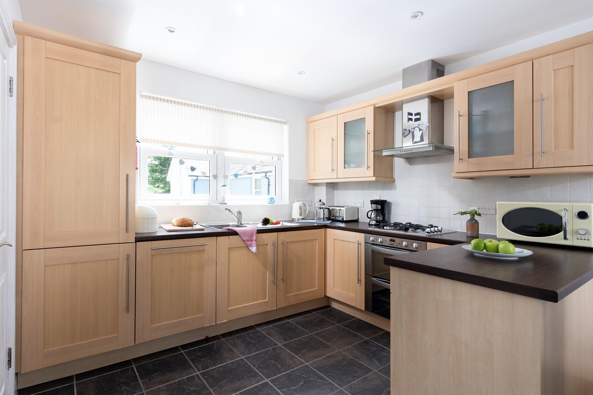 The well-equipped kitchen area is perfect to rustle up a culinary delight.