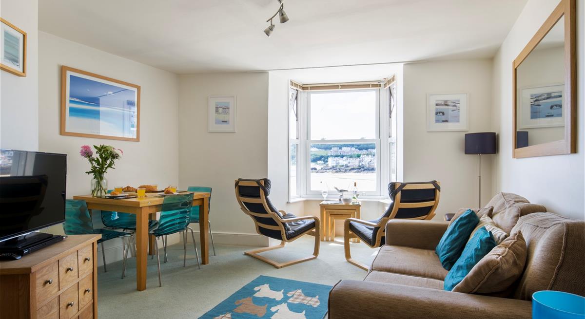 Sink into the sofa in the evening with a glass of wine and watch your favourite film.