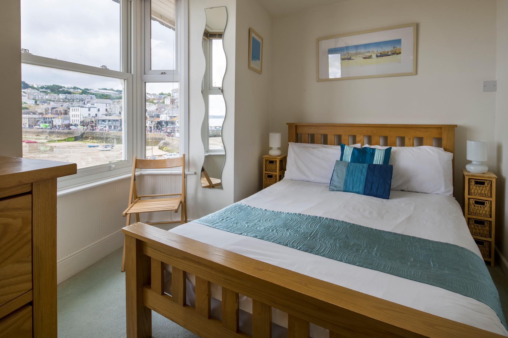 Wake up, open the blinds and watch the boats bobbing in the harbour from your bed.