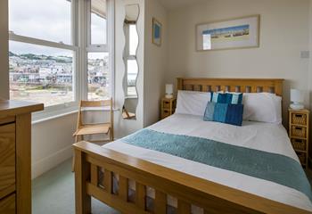 Wake up, open the blinds and watch the boats bobbing in the harbour from your bed.