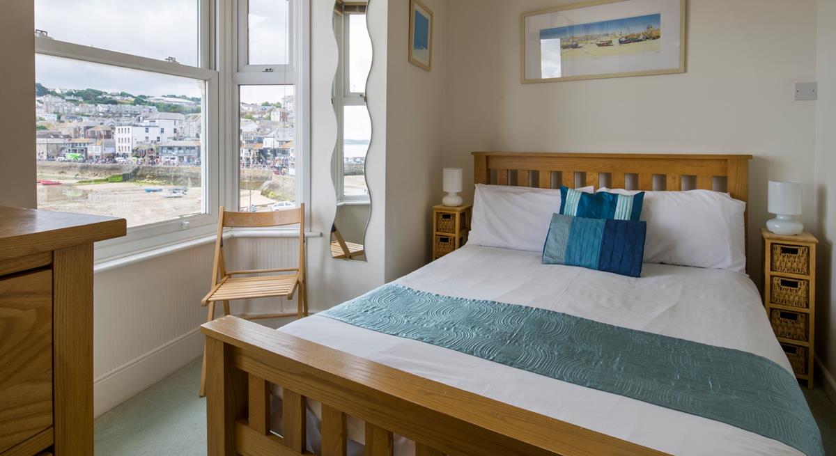 Wake up, open the blinds and watch the boats bobbing in the harbour from your bed.