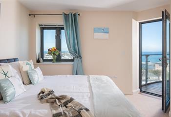 Simply slide off the bed and step onto the balcony to enjoy the breathtaking sea views each morning. 