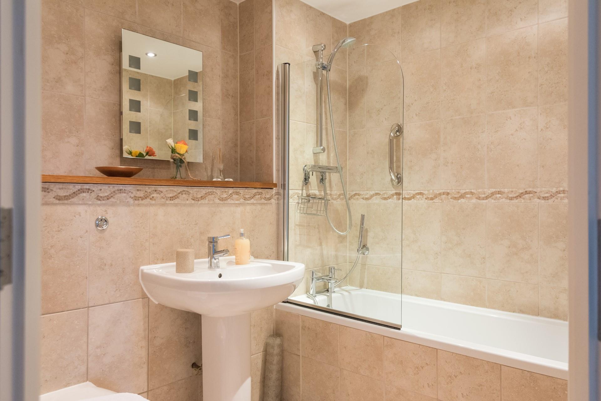 Pamper yourself before heading into town for the evening in the spacious family bathroom. 